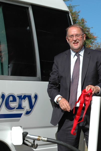 Mike Underhill fuels up the first vehicle, a Kiwi Discovery bus  